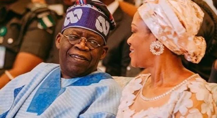 Bola Ahmed Tinubu seated beside Oluremi Tinubu
